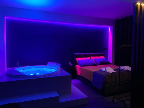 Postel nebo postele na pokoji v ubytování Palms Suites