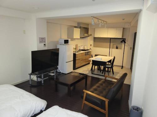 a living room with a kitchen and a dining room at Earlville - Vacation STAY 16987 in Hiroshima