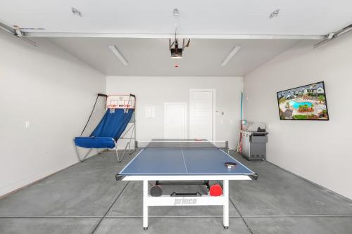 a ping pong table in the middle of a room at Ocotillo Springs Resort 45 l Brand New Property, Private Pool, Hot Tub, & Community Pool in Santa Clara