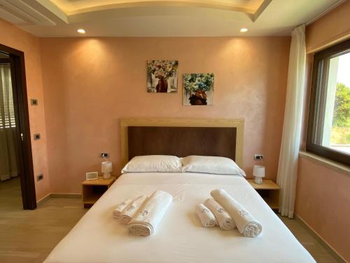Ένα ή περισσότερα κρεβάτια σε δωμάτιο στο Hera Paestum Suite con Piscina privata