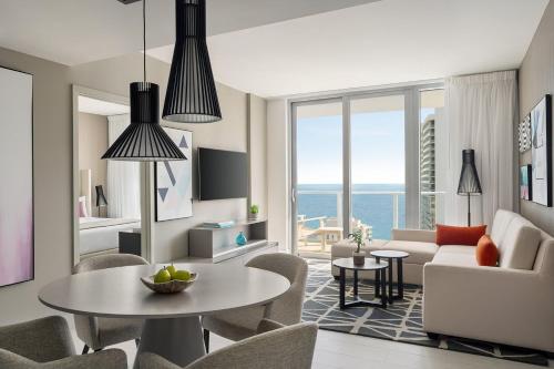 a living room with a couch and a table at Hyde Beach by Zelloo in Hollywood