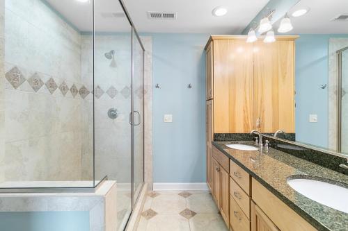 a bathroom with a shower and a sink at 16 Turtle Bay Riverview Pool in Folly Beach