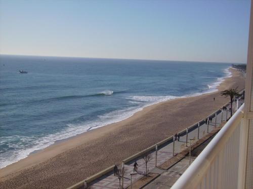 a view of the beach from a balcony at Apartaments El Sorrall in Blanes