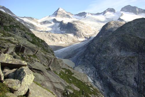 a view of a snowy mountain range with a river at Haus Edring in Tux