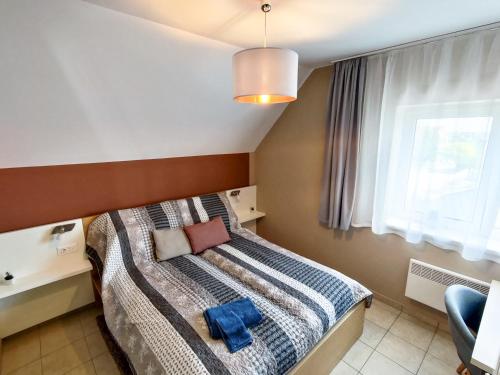 Posteľ alebo postele v izbe v ubytovaní Fügefa Apartman