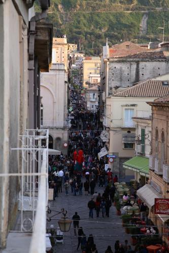 a crowd of people walking down a city street at Donnaciccina Accomodation in Tropea