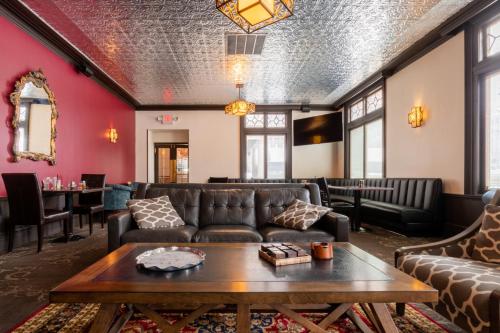 a living room with a couch and a table at Spokane Club Hotel in Spokane