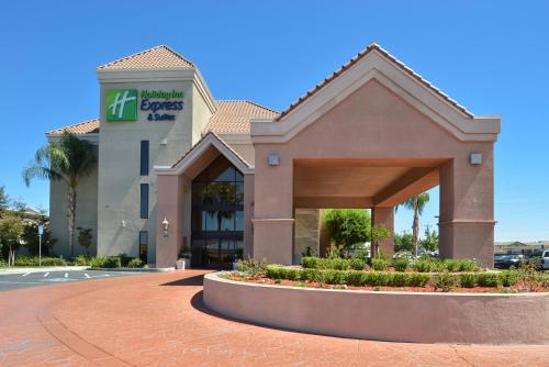 a building with a sign in front of it at Holiday Inn Express & Suites Lathrop by IHG in Lathrop