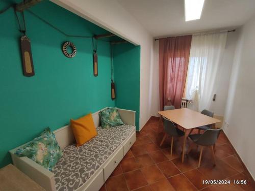 a small room with a couch and a table at L'Amica di Napoleone Elba island in Portoferraio