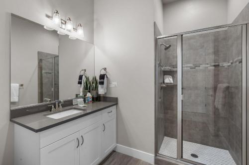 a bathroom with a glass shower and a sink at Ocotillo Springs 67 Low Prices, Private Hot Tub, Pool, Basketball Arcade, Ping Pong and Community Pool in Santa Clara
