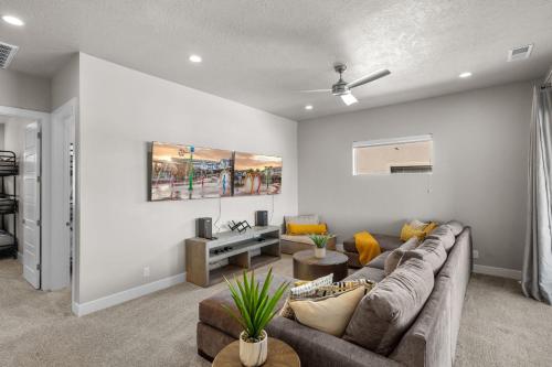 a living room with a couch and a table at Ocotillo Springs 67 Low Prices, Private Hot Tub, Pool, Basketball Arcade, Ping Pong and Community Pool in Santa Clara