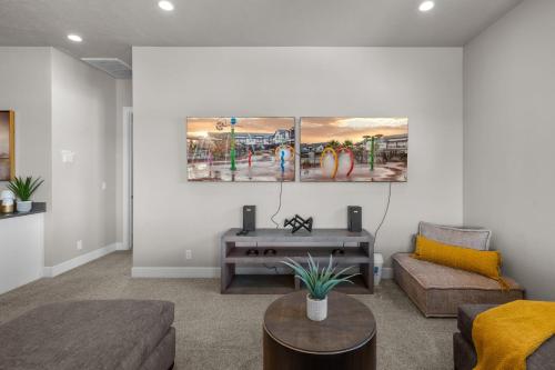 a living room with a couch and a table at Ocotillo Springs 67 Low Prices, Private Hot Tub, Pool, Basketball Arcade, Ping Pong and Community Pool in Santa Clara