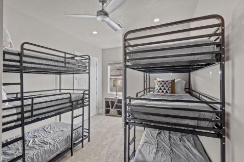 a bedroom with two bunk beds in a room at Ocotillo Springs 67 Low Prices, Private Hot Tub, Pool, Basketball Arcade, Ping Pong and Community Pool in Santa Clara