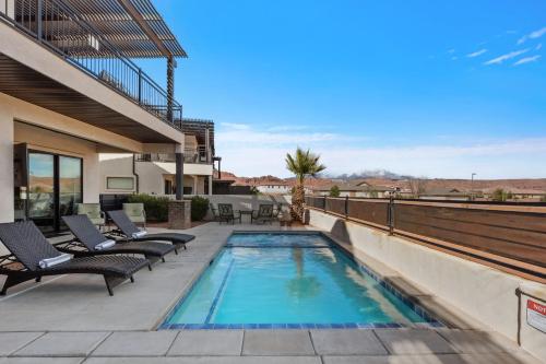 a swimming pool on the roof of a house at Ocotillo Springs 67 Low Prices, Private Hot Tub, Pool, Basketball Arcade, Ping Pong and Community Pool in Santa Clara