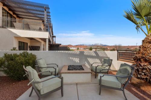 a group of chairs and a table on a patio at Ocotillo Springs 67 Low Prices, Private Hot Tub, Pool, Basketball Arcade, Ping Pong and Community Pool in Santa Clara