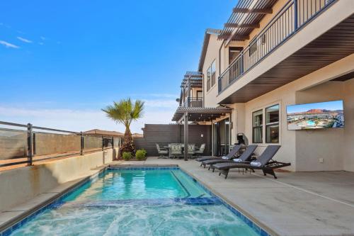 a house with a swimming pool on a patio at Ocotillo Springs 67 Low Prices, Private Hot Tub, Pool, Basketball Arcade, Ping Pong and Community Pool in Santa Clara