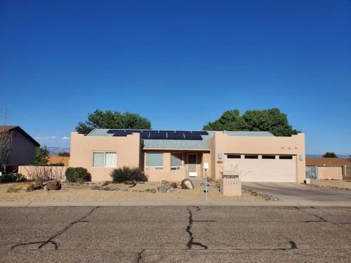 a house with solar panels on top of it at Work and Play Close to Sedona in Clarkdale