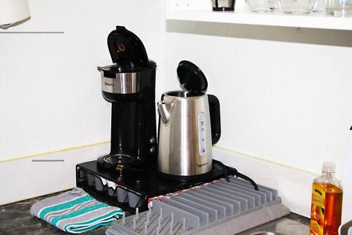 a coffee maker sitting on top of a counter at Work and Play Close to Sedona in Clarkdale