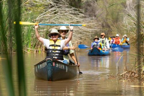 a group of people in kayaks on a river at Work and Play Close to Sedona in Clarkdale