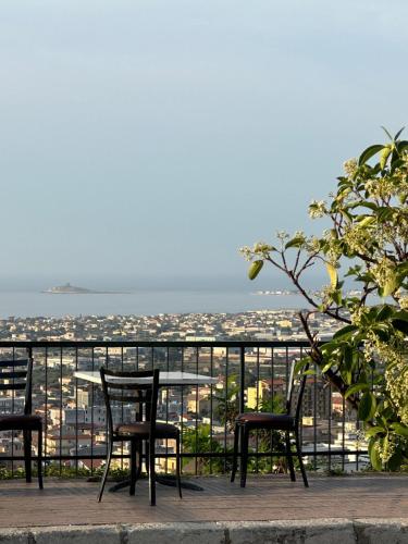 a table and chairs on a balcony with a view at Domus Mea Apartments in Carini