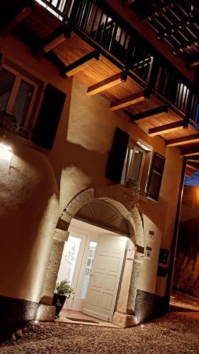an entrance to a building with a white door at Casa Pitem in Nago-Torbole