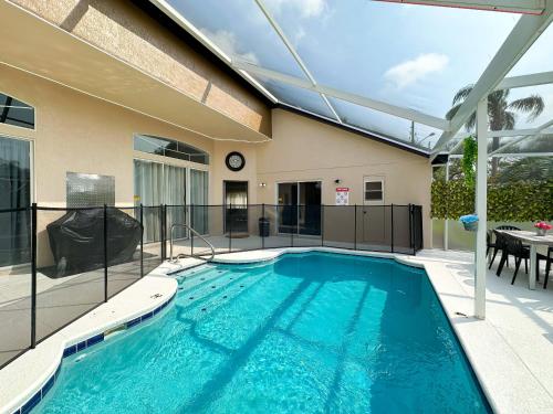 a swimming pool in the backyard of a house at Themed house with private Game Room and Pool in Loughman