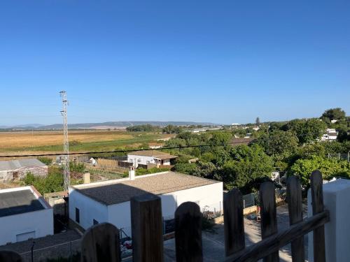 a view from the balcony of a house with a fence at Casa La Oliva Vejer in Vejer de la Frontera