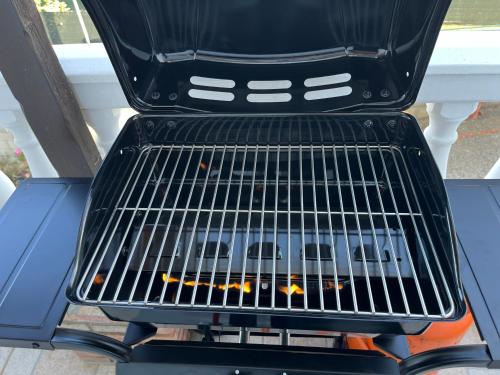a grill with a fire inside of it at Casa La Oliva Vejer in Vejer de la Frontera