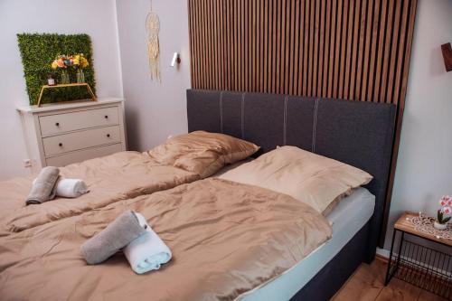 a bed with two pillows on it in a bedroom at sunny & cozy - Netflix - WIFI - City - 4 Person in Essen