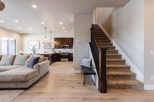 a living room with a couch and a staircase at Ocotillo 70 Red Mountain View Resort, Private Pool & Hot Tub in Santa Clara