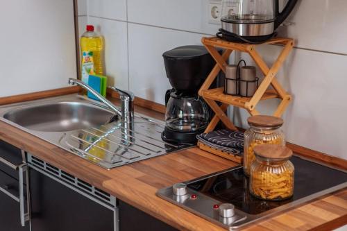 a kitchen counter top with a sink and a counter top at sunny & cozy - Netflix - WIFI - City - 4 Person in Essen