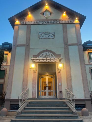 a building with stairs leading up to a door at Suite Hotel Nettuno in Sestri Levante