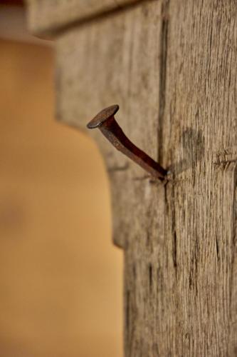 a wooden post with a bird sticking out of it at Baudenkmal Mühle Schalchen in Wildberg
