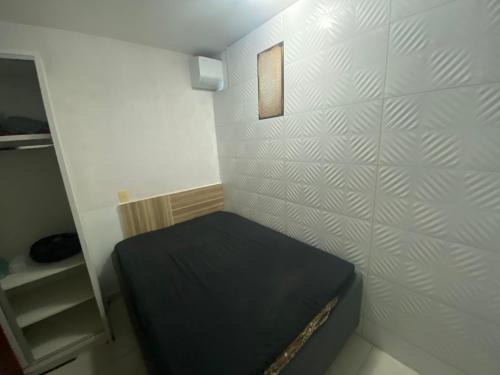 Ένα ή περισσότερα κρεβάτια σε δωμάτιο στο Enseada Nautico Residence DE PAULA