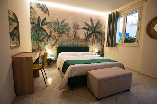 a bedroom with a bed with a green comforter at RelaxTime Casa Vacanze in Palermo