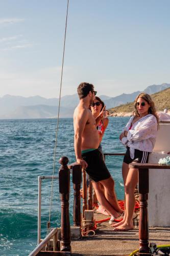 a group of people on a boat in the water at Hostel Hasta La Vista in Sarandë