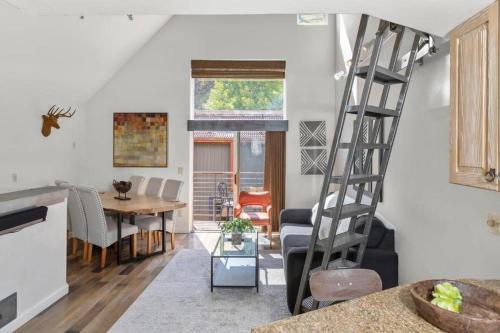 a kitchen and living room with a ladder in a room at Luxury Condo - Open for Bluegrass in Telluride