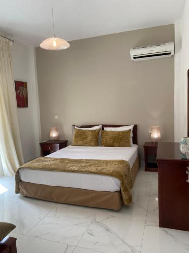 Ένα ή περισσότερα κρεβάτια σε δωμάτιο στο Sole e Mare Suite at Sidari Beach