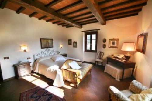 a large bedroom with a bed and a couch at Agriturismo San Valentino in Amelia