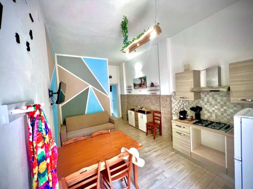 a kitchen and dining room with a table in a room at Villa Latino in Vieste