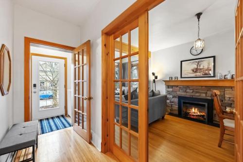 a living room with a fireplace and a couch at Picturesque & Serene Gem in Port Credit - Steps to Lake - Backyard in Mississauga