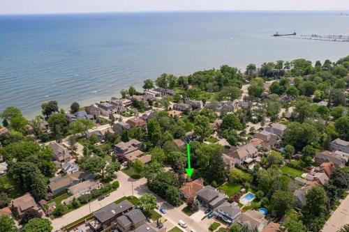 an aerial view of a residential neighborhood next to the water at Picturesque & Serene Gem in Port Credit - Steps to Lake - Backyard in Mississauga