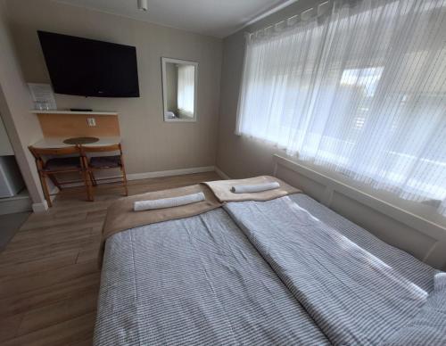 Postel nebo postele na pokoji v ubytování Corner