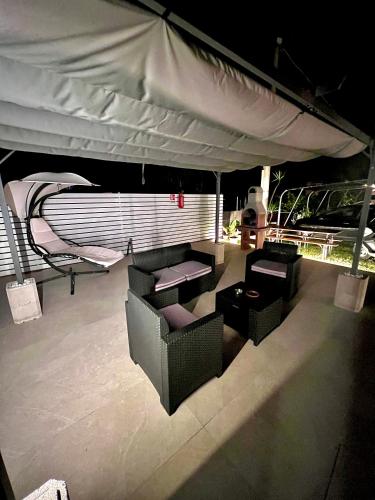 a table and chairs under a tent on a boat at Villa Latino in Vieste