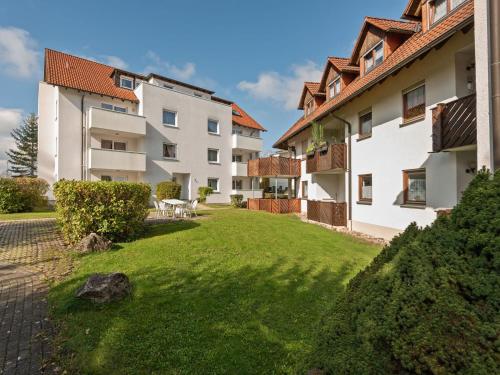 an apartment building with a lawn in front of it at Spacious Apartment near Forest in Bad D rrheim in Bad Dürrheim