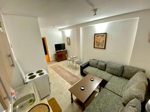 a living room with a couch and a table at Apartman MyHome Travnik in Travnik