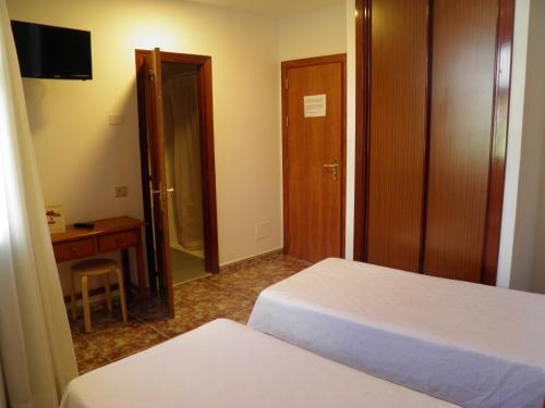 Katil atau katil-katil dalam bilik di Hostal Albacar