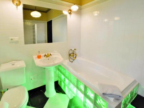 a bathroom with a sink and a tub and a toilet at Villa in Kr g near Knight's Castle in Pollnow