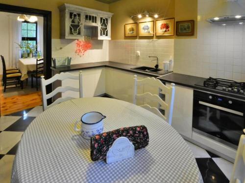 a kitchen with a table with a plate on it at Villa in Kr g near Knight's Castle in Pollnow