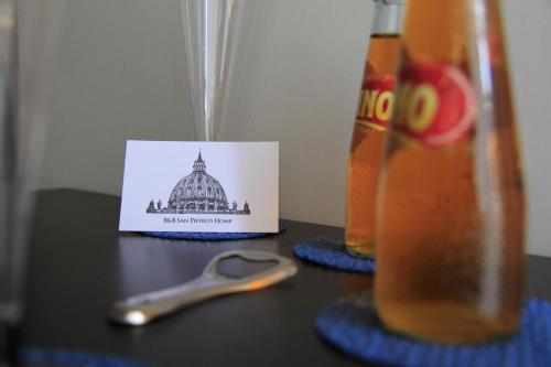 a pair of scissors sitting on a table with a picture of a building at San Pietro's Home - Guesthouse in Rome